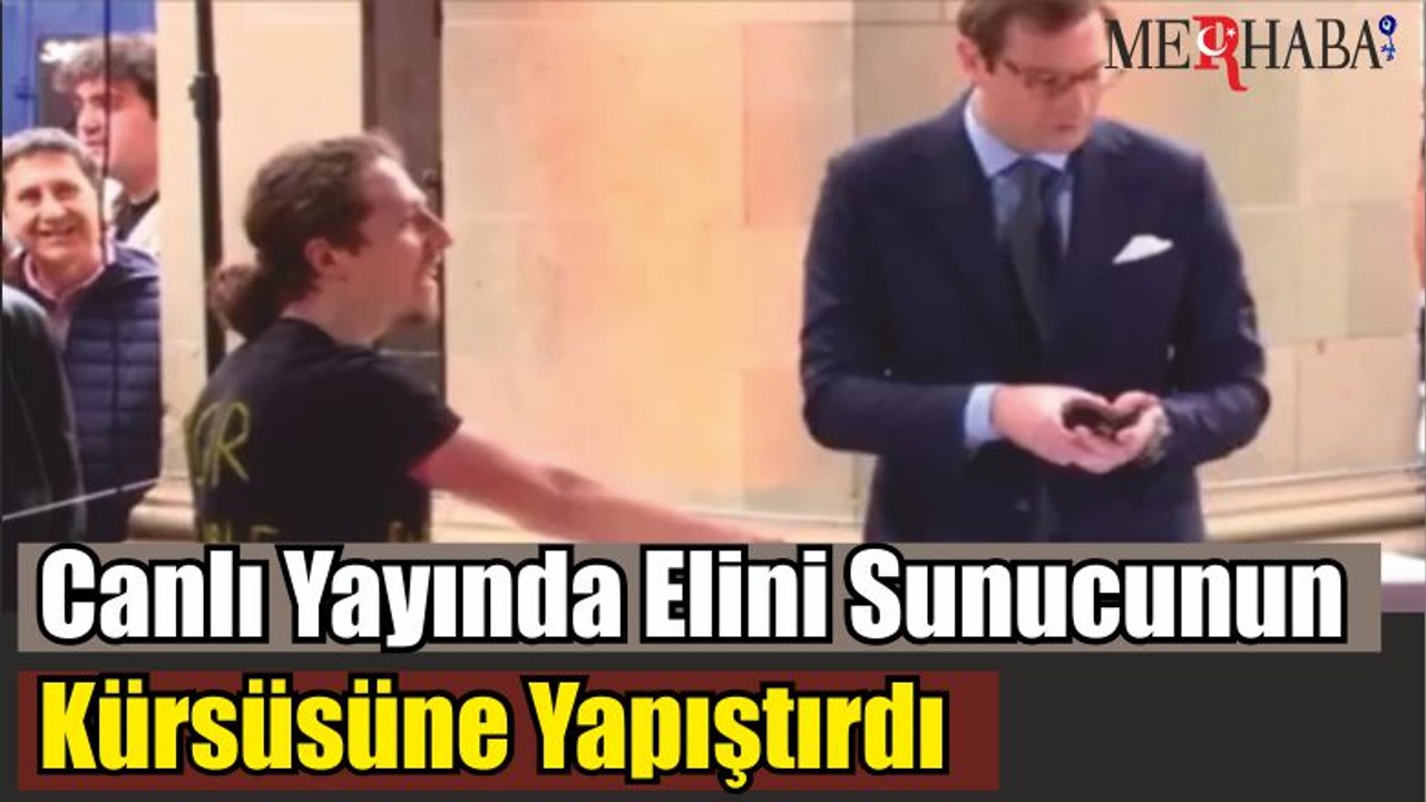 Canlı Yayında Elini Sunucunun Kürsüsüne Yapıştırdı
