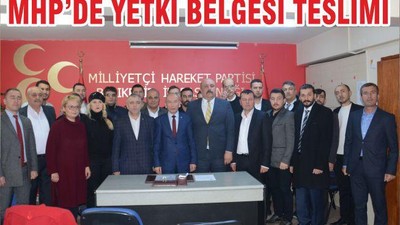 MHP’DE YETKİ BELGESİ TESLİMİ